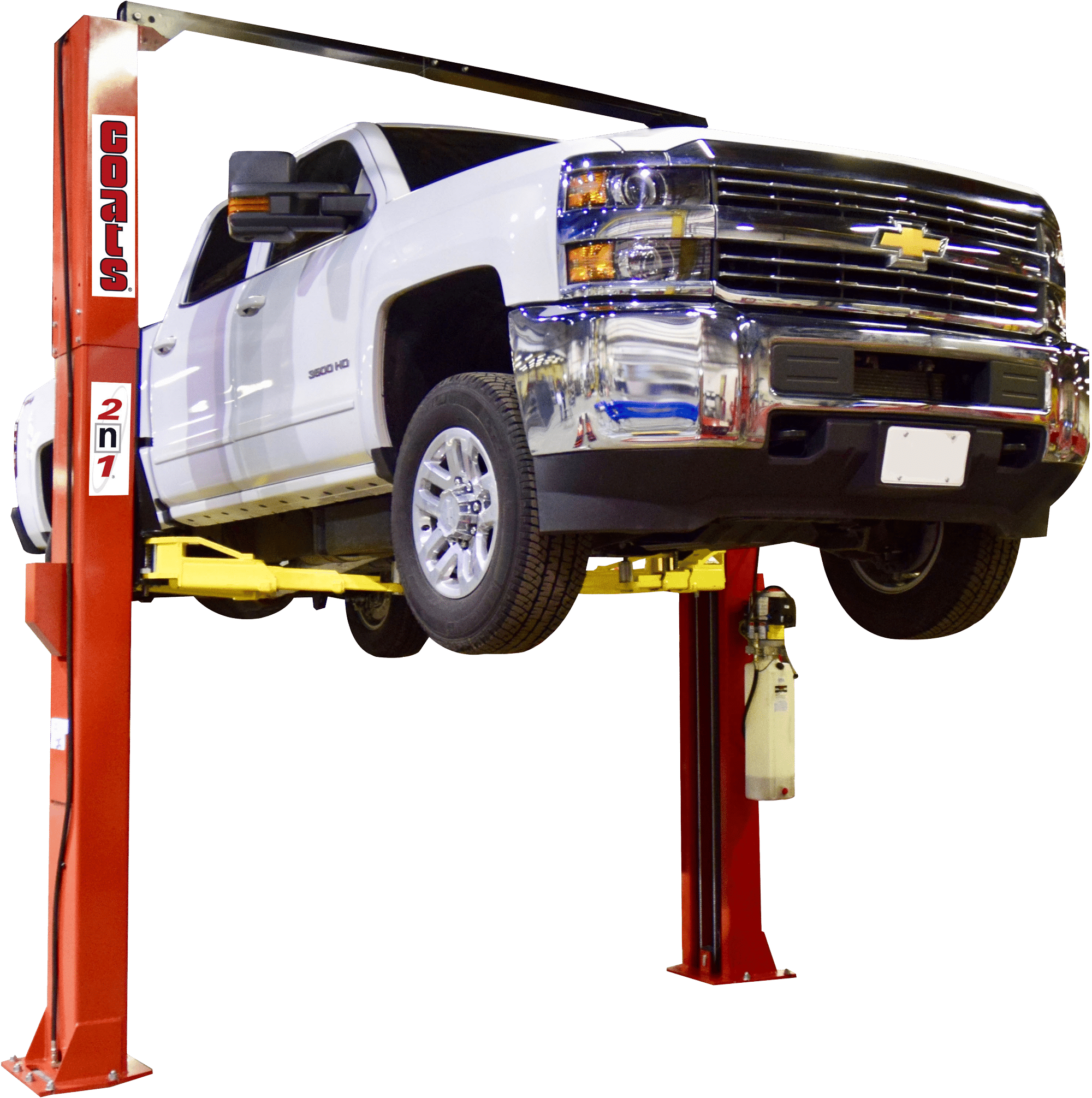 A white chevy truck is lifted on a Coats two post lift