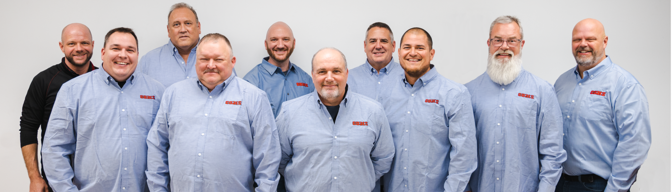 Coats Company Sales Team group photo wearing Coats branded shirts.