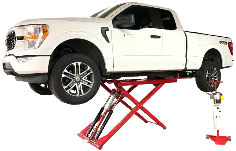 A white, light duty truck is raised on a red, Coats 6K Mid Rise Portable Scissor Lift