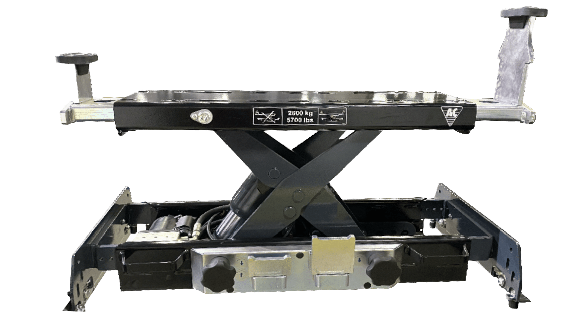 Black and silver frame that serves as a rolling jack for scissor lifts