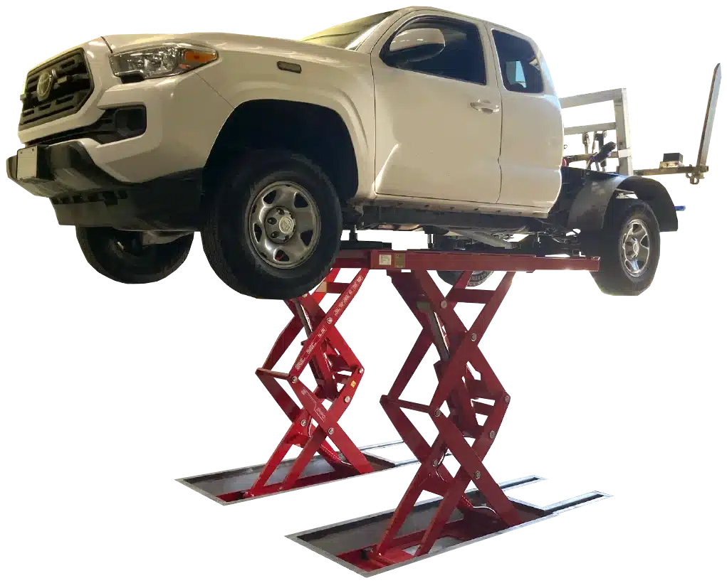 A White, light truck is lifted on a flush mounted Coats 10K dual scissor lift